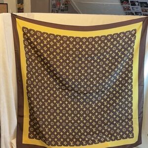 Vintage Louis Vuitton 100% silk scarf measuring 34” x 34”.
